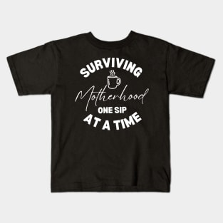 Surviving Motherhood One Sip At a Time Funny Coffee Lover Mom Gift Idea Kids T-Shirt